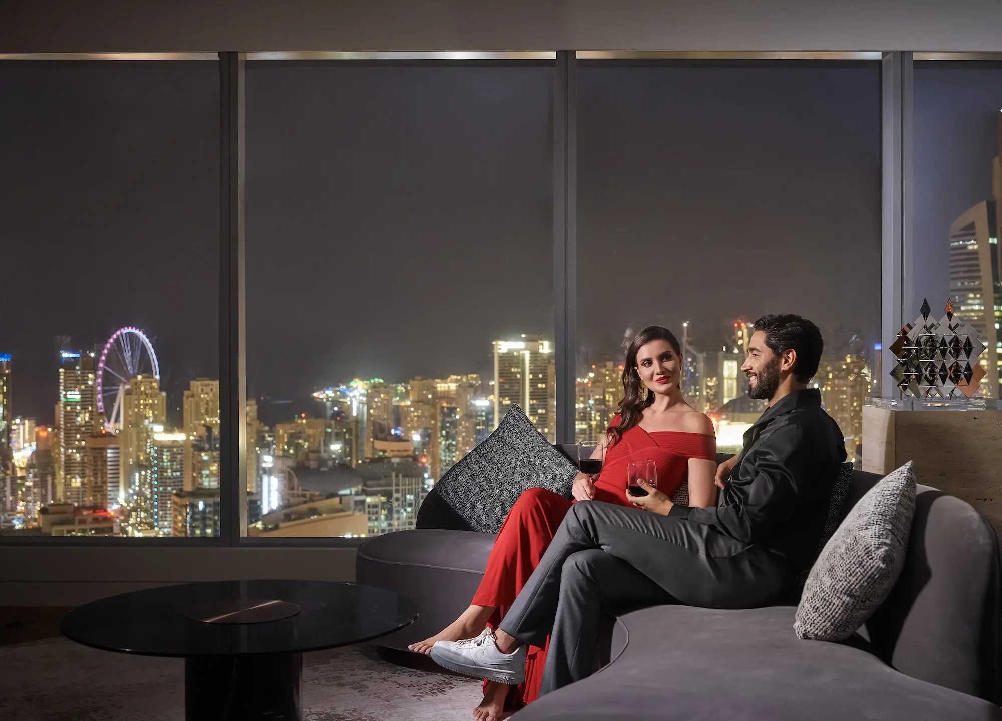 Couple enjoys wine overlooking Dubai skylineat SO/ Uptown Dubai Residence